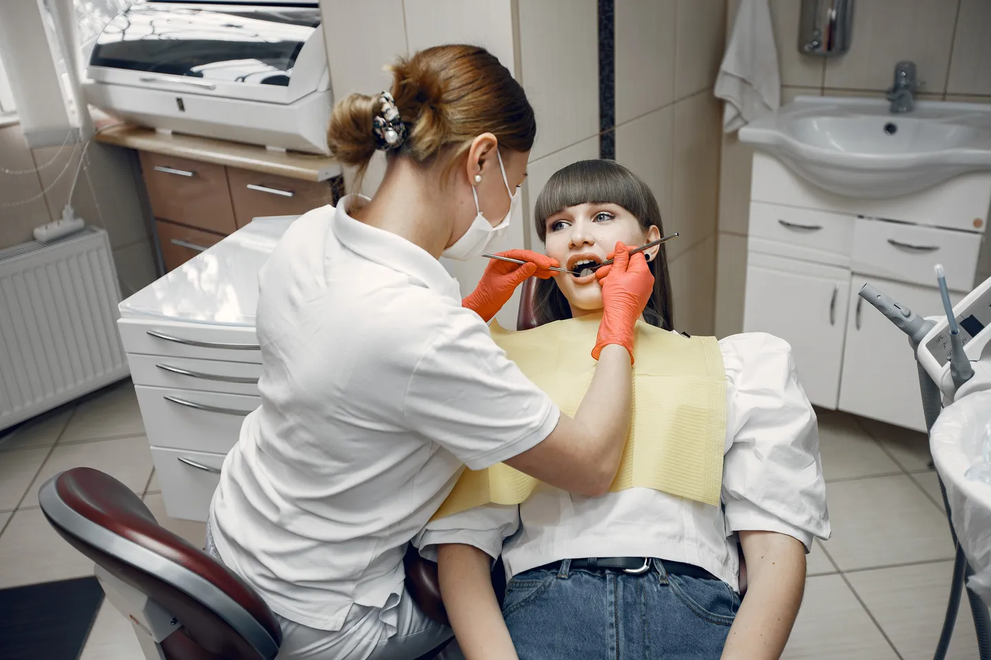 woman-dental-chair-girl-is-examined-by-dentist-beauty-treats-her-teeth (1).jpg