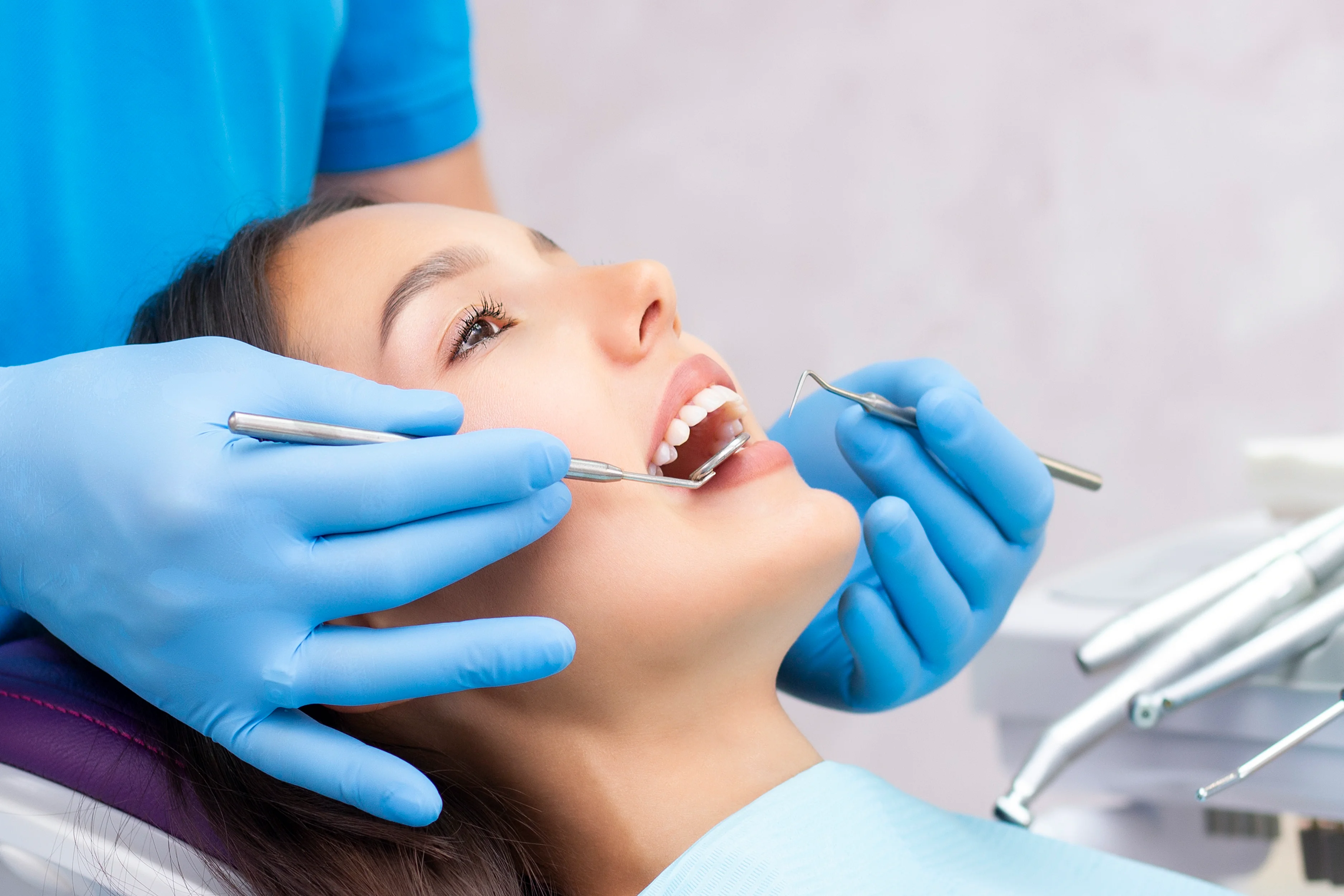 attractive-young-woman-dental-clinic-with-male-dentist-healthy-teeth-concept.webp
