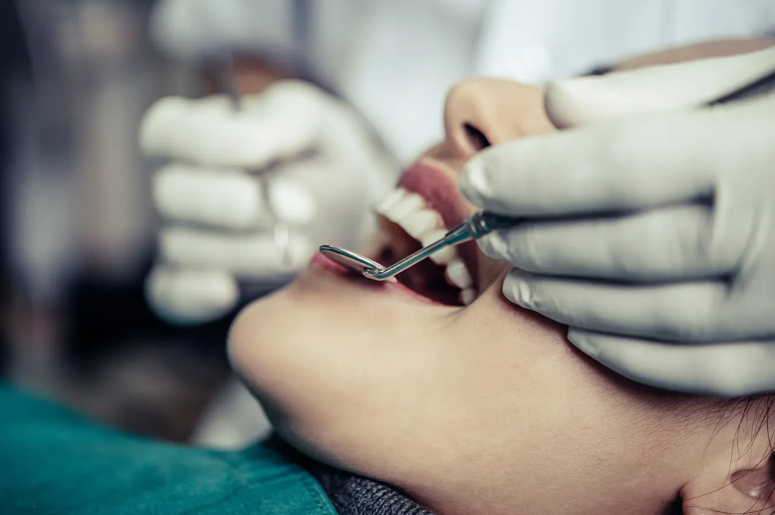 dentists-treat-patients-teeth (1).webp